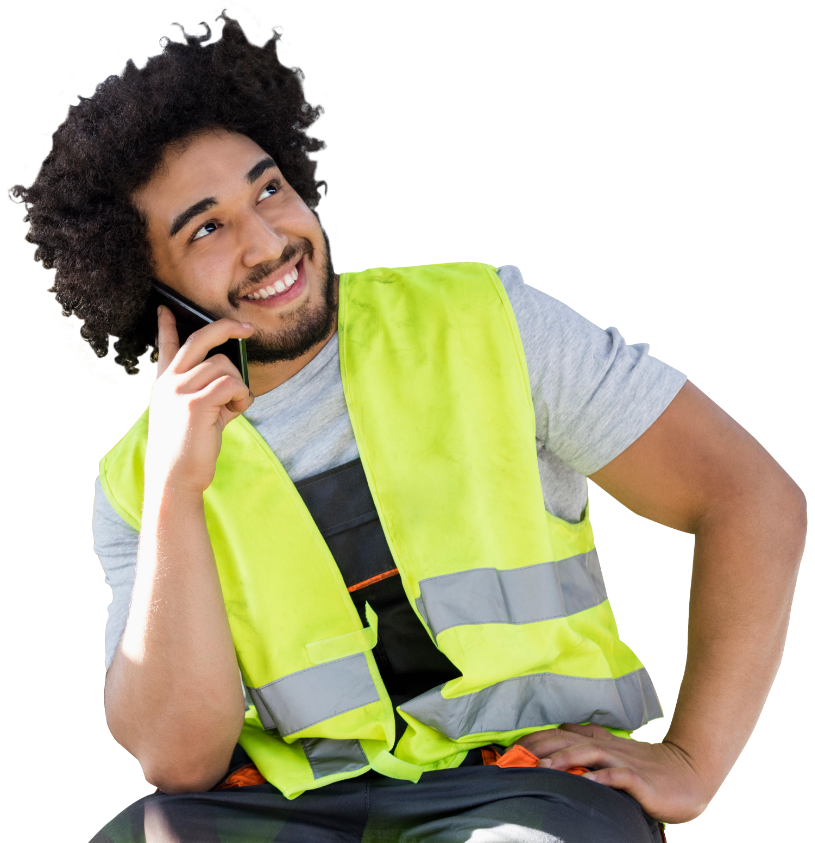 A man in high vis vest on the phone and smiling